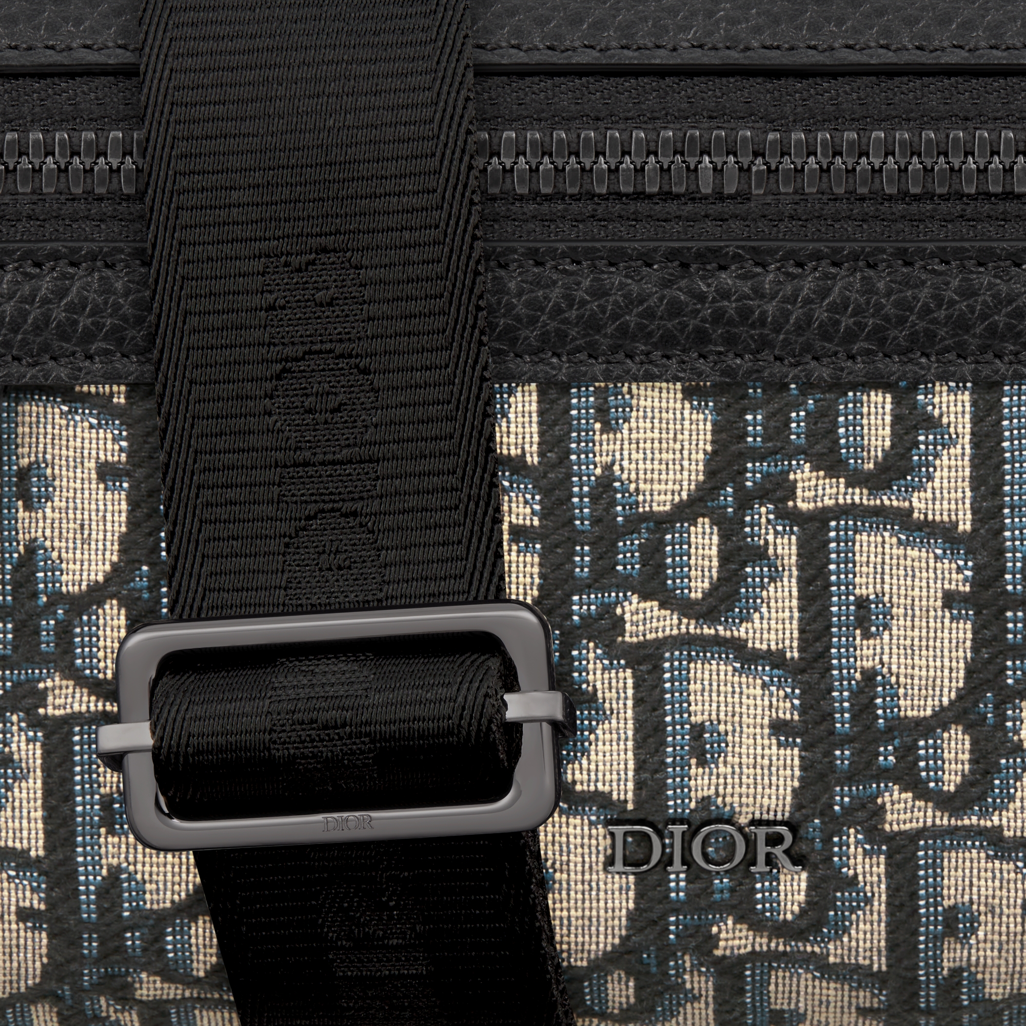 迷你 Rider 2.0 拉链式信使包 米色和黑色 Oblique 印花面料搭配黑色粒面牛皮革 E09