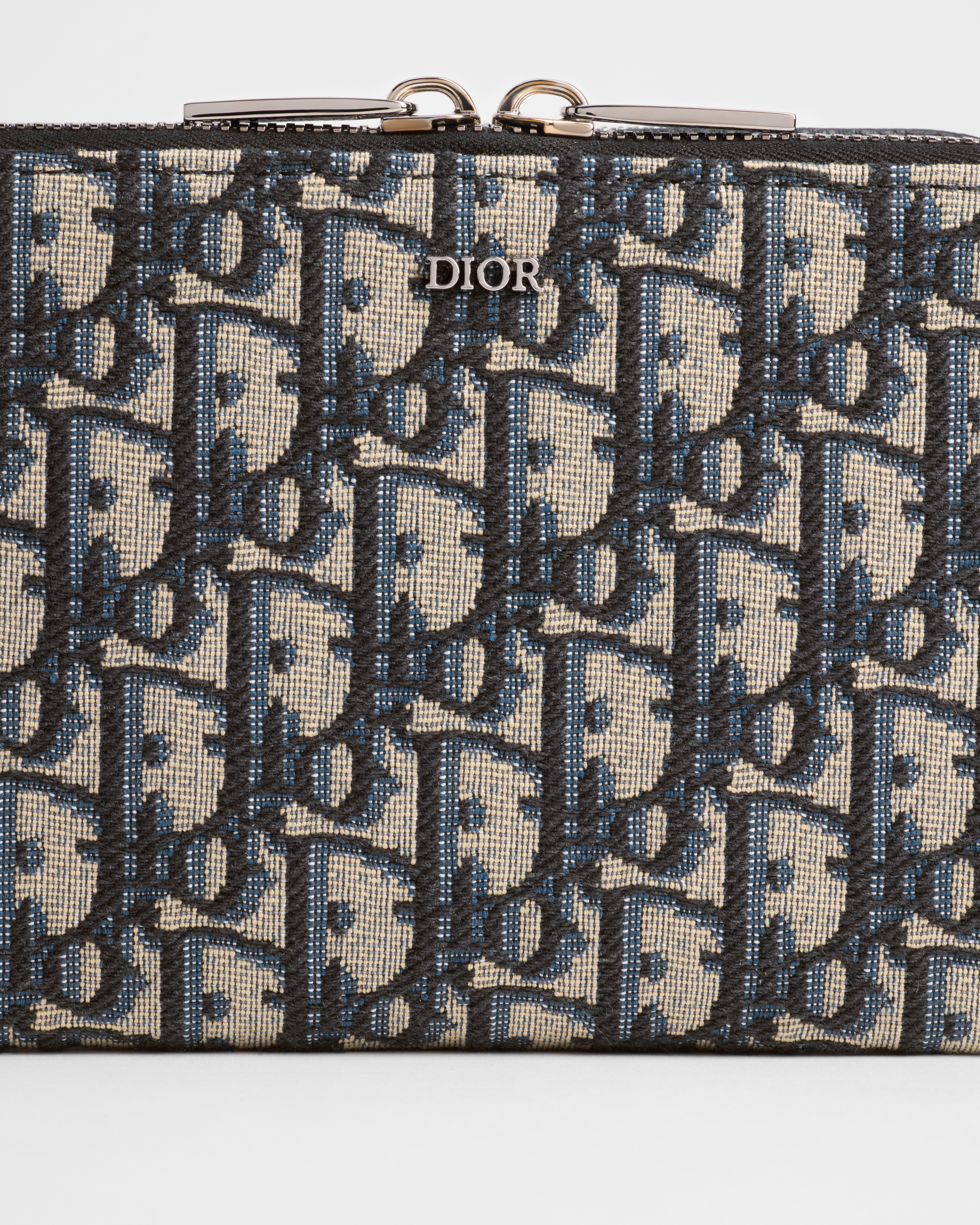 拉链手拿包（附肩带） 米色和黑色 Oblique 印花面料 E10