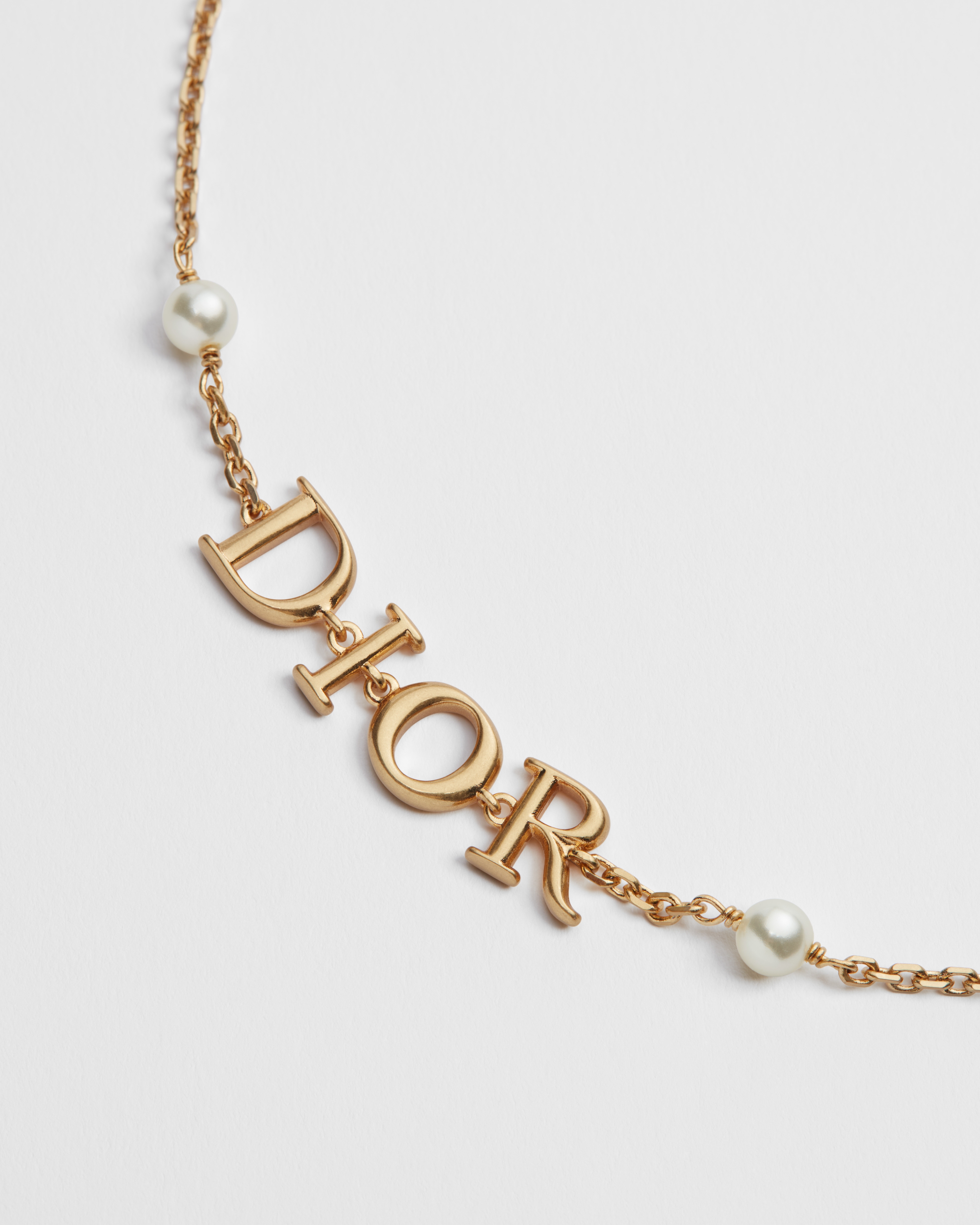 Dio(r)evolution 手链 金色饰面金属和白色树脂珠饰 E09