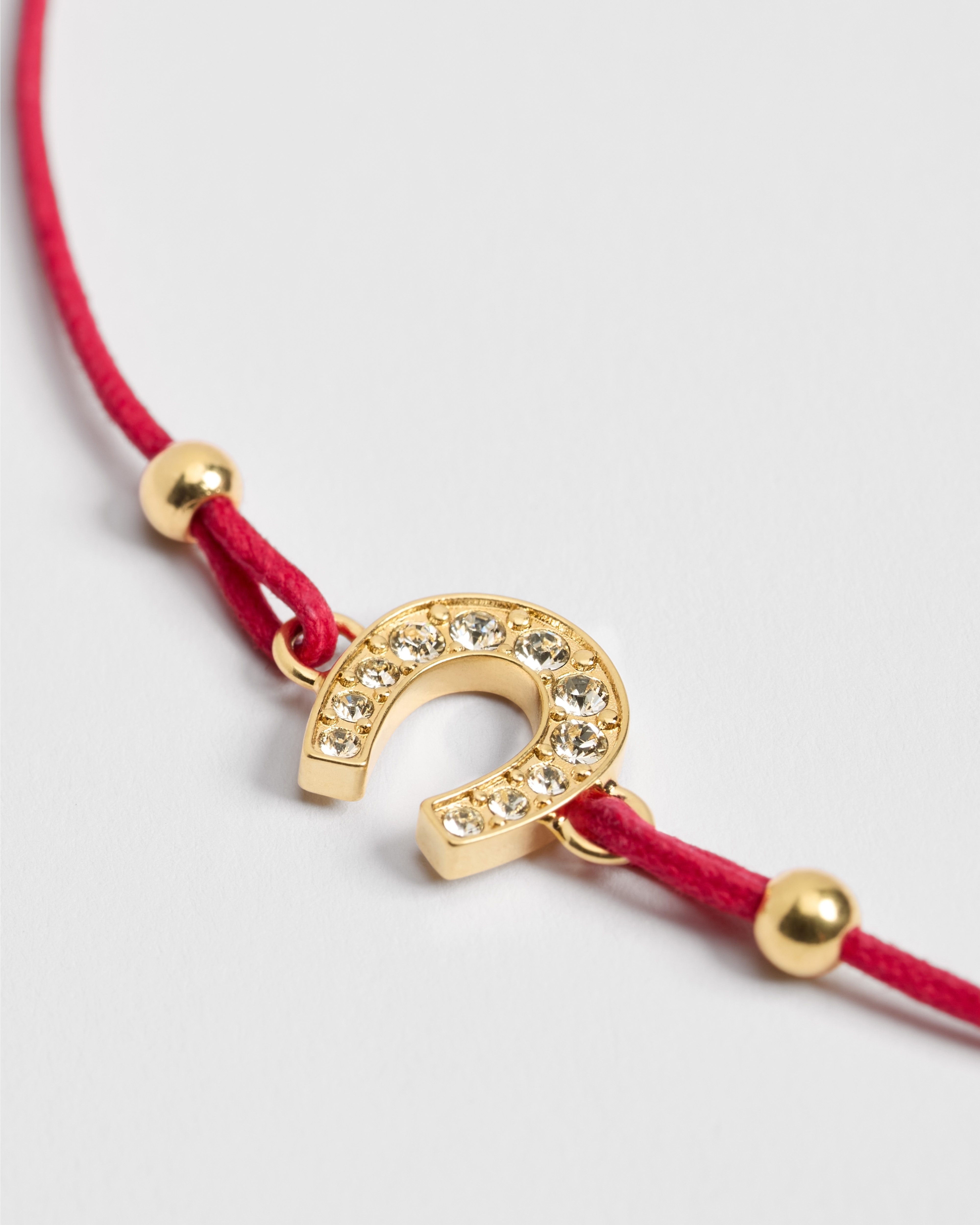 Diorelita 手链 金色饰面金属、白色晶体装饰和红色棉质绳线 E09