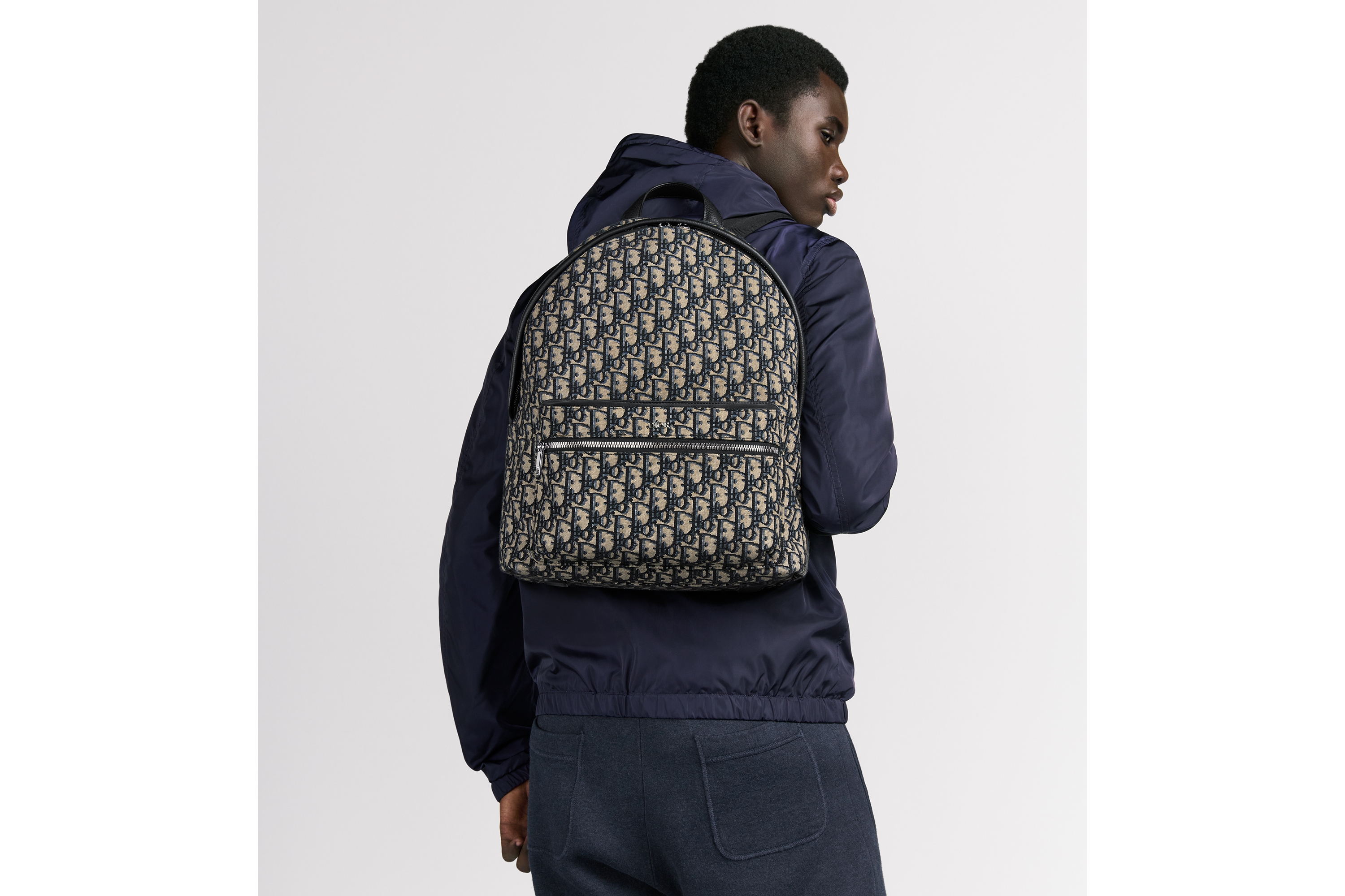 look_image_alt_prefix Rider 双肩背包 米色和黑色 Oblique 印花面料 E19